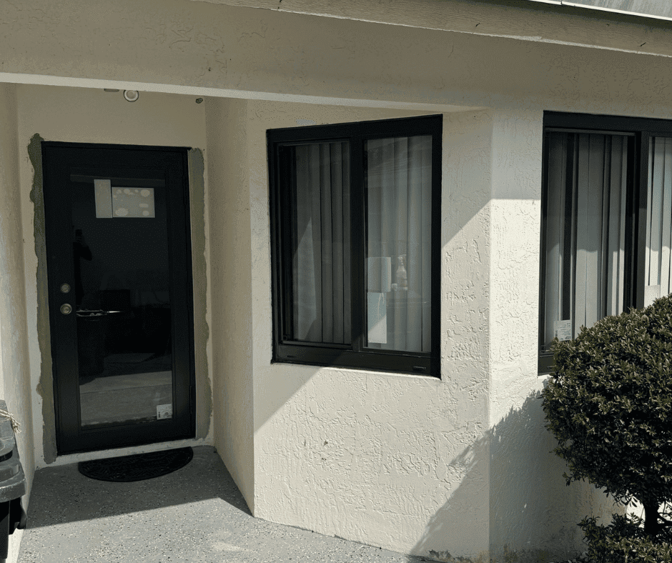 After - new white-frame impact windows professionally installed by Empire Home Pros